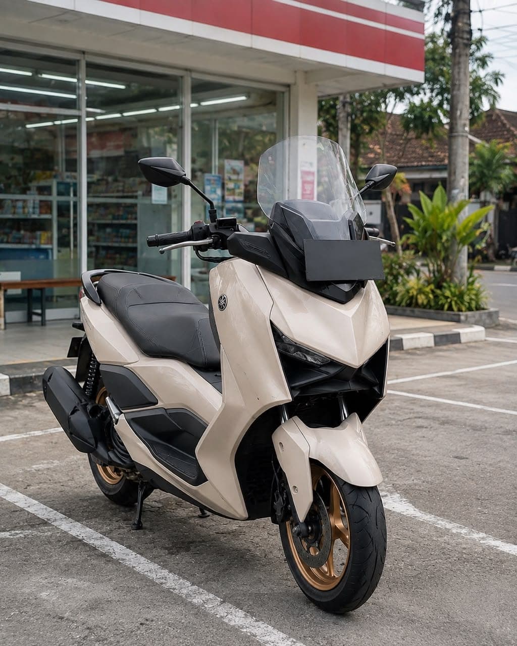 Yamaha XMAX 250 in cream with gold wheels, available for rent in Bali